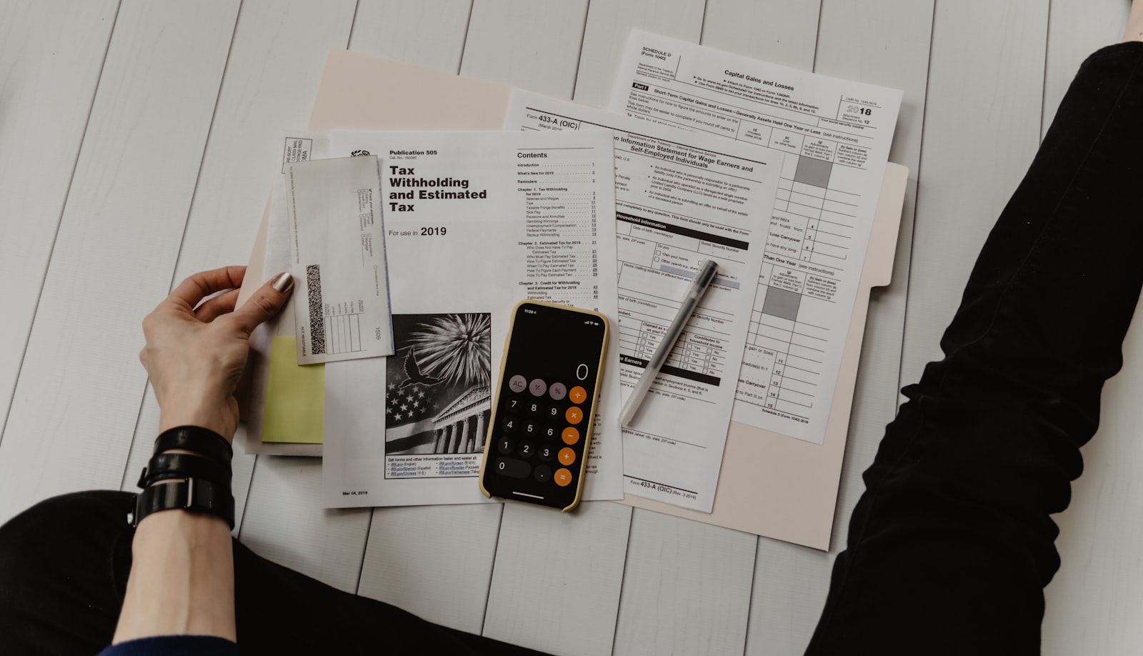 Corporate documents on a desk, illustrating UAE free zone corporate tax questions